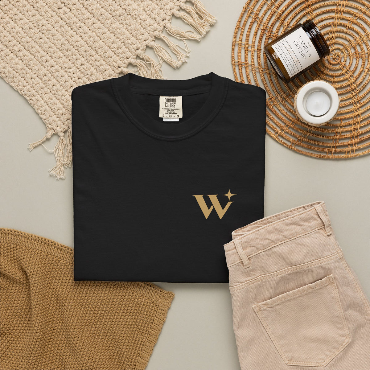 Worthy Essential Heavyweight Tee laid flat beside neutral accessories